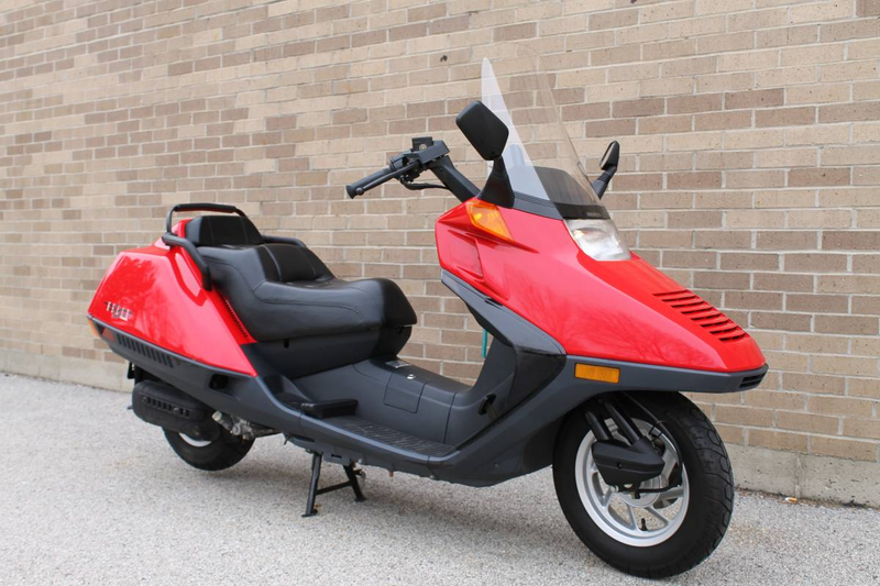 Illustration for article titled At $2,499, Could This Incredibly Low Mileage 1999 Honda CN250 Helix Get You To Scoot?